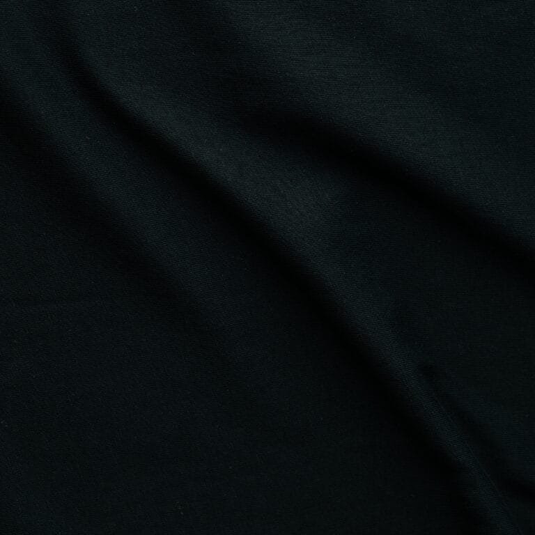Dark fabric waves background texture - close up of a textile background